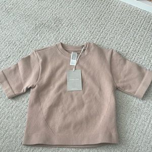 Everlane short sleeve shirt. Somewhat cropped. Size M/L. Super stretchy